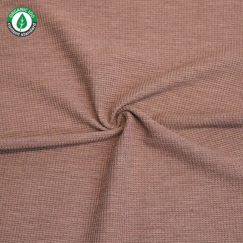 How do bamboo fiber fabrics contribute to reducing the carbon footprint of the textile industry?